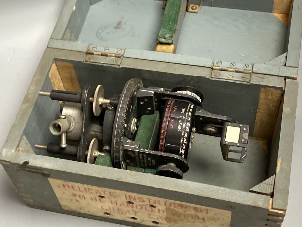 An Air Ministry Astro compass MkII, a similar compass, both cased, a Hydrographic Office Star Identifier and spare Azimuth circle compa